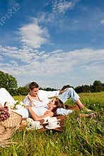 Summer picnic - Happy couple in meadow