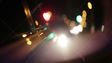 Police lights flashing in side view mirror of car