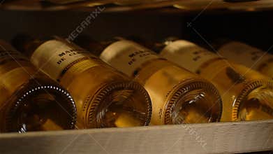 Macro Wine Bottles Ripen to Optimal Age in Refrigerated Cabinet