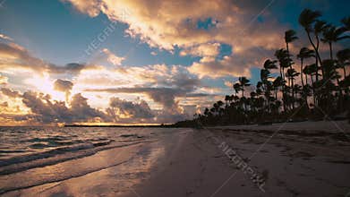Sunrise over tropical island beach and palm trees. Punta Cana Dominican Republic