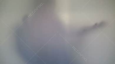 Terrifying male silhouette emerging, flashing, scary gestures