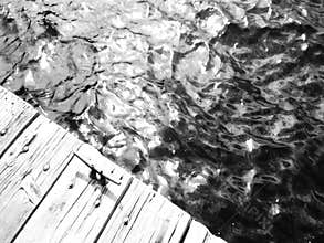 The shimmer of the water off a dock on Echo Lake in the Sierras.