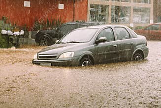 Car stuck in flash flood disaster