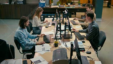 Business Group of Casual People is Working at Computers in the Open Space Office