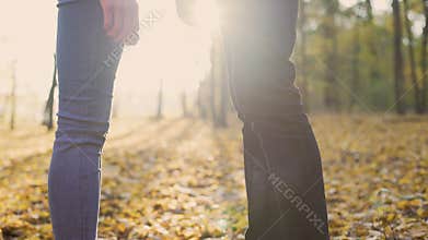 Couple of young lovers tenderly holding each other's hands, enjoying date