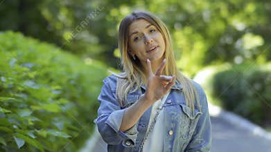 Beautiful deaf-mute girl saying - hear us, we are and we love you