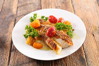Fish cooked with tomato