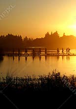 A group of people walking on the footpath on water