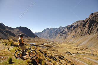 Mountain Biker Looking at Valley