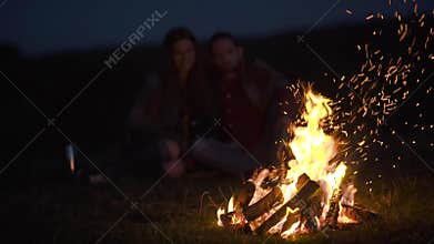 Romantic Weekend. Couple In Love Near Bonfire In Nature