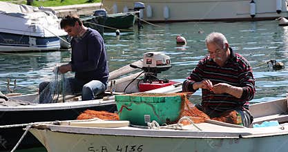Fisherman patches fishing
