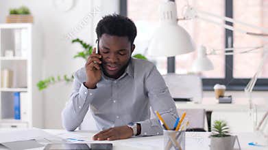 Businessman calling on smartphone at office
