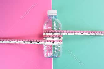 Bottles of water with tape measure