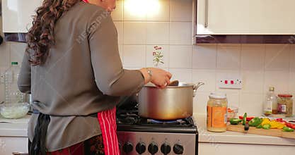 Woman making curry at home