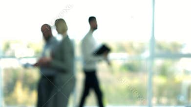 Blurred business people walking in the lobby.