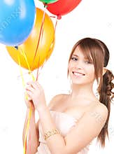 Happy teenage girl with balloons