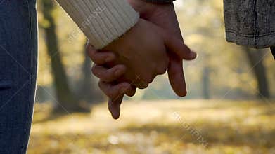 Couple letting go of their hands in slow motion, end of relationship, separation