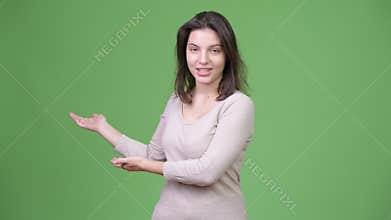 Young beautiful woman presenting something