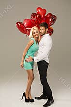 Couple with Bouquet of Heart Balloons