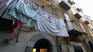 Shabby Italian city district with lots of clean laundry drying on balconies