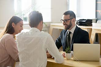 Friendly lawyer or financial advisor in suit consulting young co