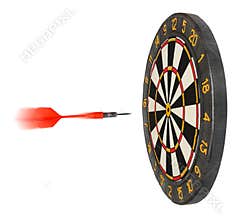 Dartboard with dart flying in aim