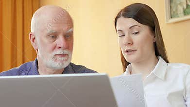 Senior man talking to financial adviser. Female consultant explaining senior client his pension plan