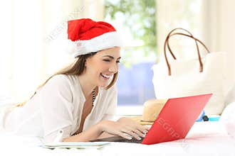 Woman writing emails on christmas holidays