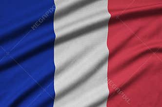 France flag is depicted on a sports cloth fabric with many folds. Sport team banner