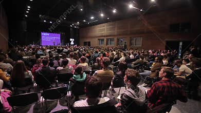 Brest, Belarus - MAY 9, 2018: Many people sitting in a big room and listening to seminar.