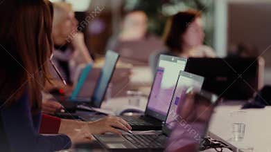 Group of people working on laptops hands