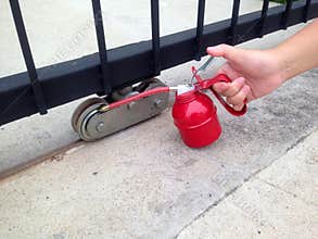 Use oiler to lubricate the door wheels.
