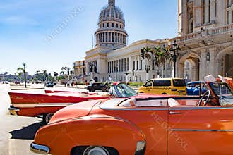 Orange fender of american classic cars in front of Capitolio, Havana, Cuba