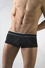 Attractive male body in black underwear