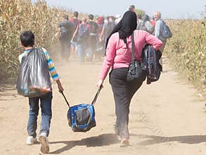 Refugees walking through the fields near the Croatia Serbia border, between the cities of Sid Tovarnik on the Balkans Route