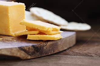 Block of Cheddar Cheese with Slices
