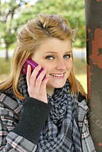 Teen with cell phone outdoors