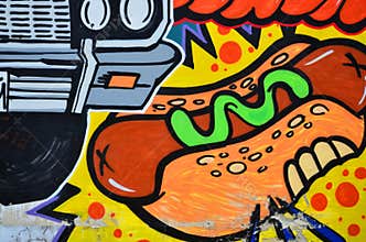 Fragment of an old wall with colorful graffiti painting