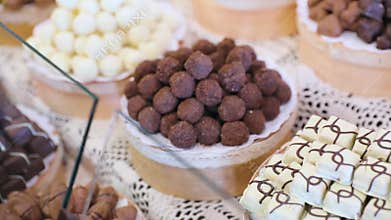 Chocolate store. Chocolate sweets on shelves in shop