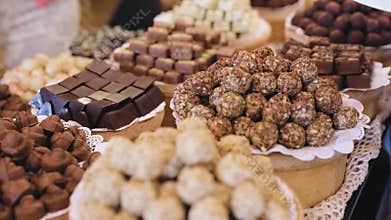 Chocolate store. Shelves with handmade sweets closeup