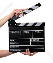 Two hands with a movie clapper board open.