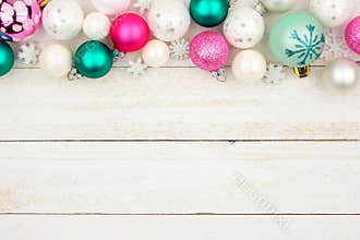 Pastel Christmas bauble top border over white wood