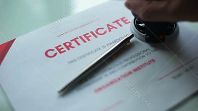 Certificate document approved, hand stamping seal on official paper, validation