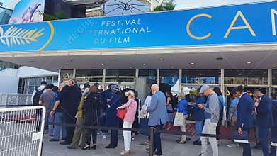 Cannes film festival visitors in queue, famous annual culture event in France