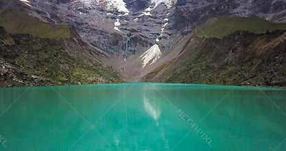 Humantay lake in Peru on Salcantay mountain in the Andes at 5473m altitude, aerial video
