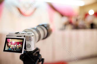 Video camera recording the great moment in wedding ceremony.