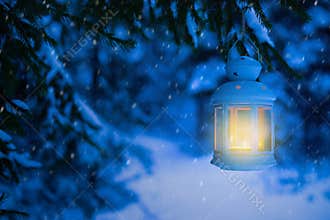Lantern for Christmas in the woods under the tree. Lantern with