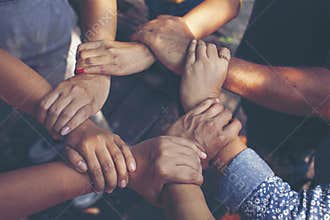 Team Work Concept : Group of Diverse Hands Together Cross Processing of young people in the nature