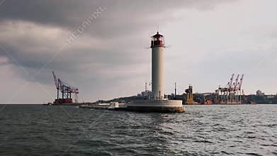 Lighthouse in slow motion. Sea Port of Odessa, Ukraine. Black Sea.