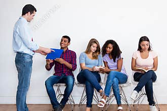 Businessman talking with indian student for job interview